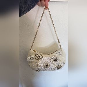 Beaded purse with chain strap.